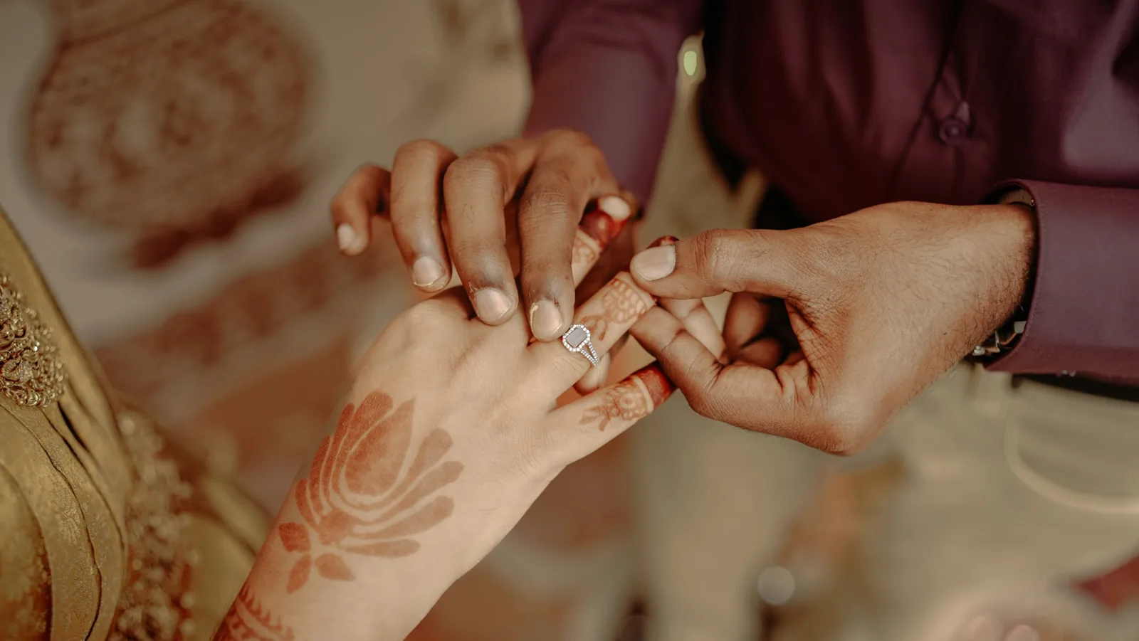 The ring being placed on her finger