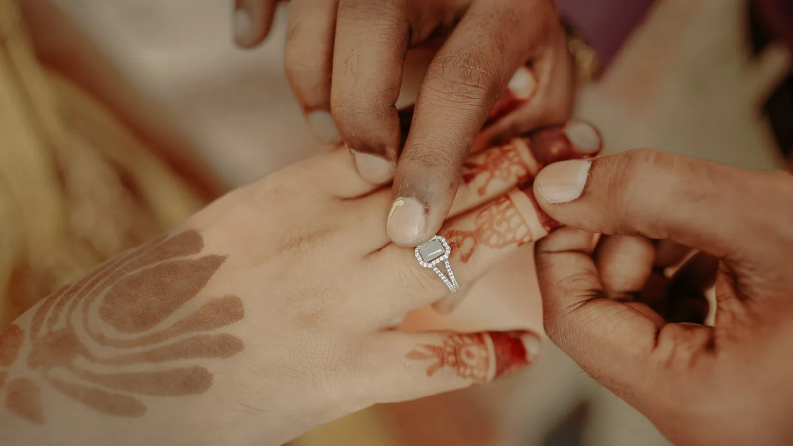 Close view of the engagement ring and mehendi