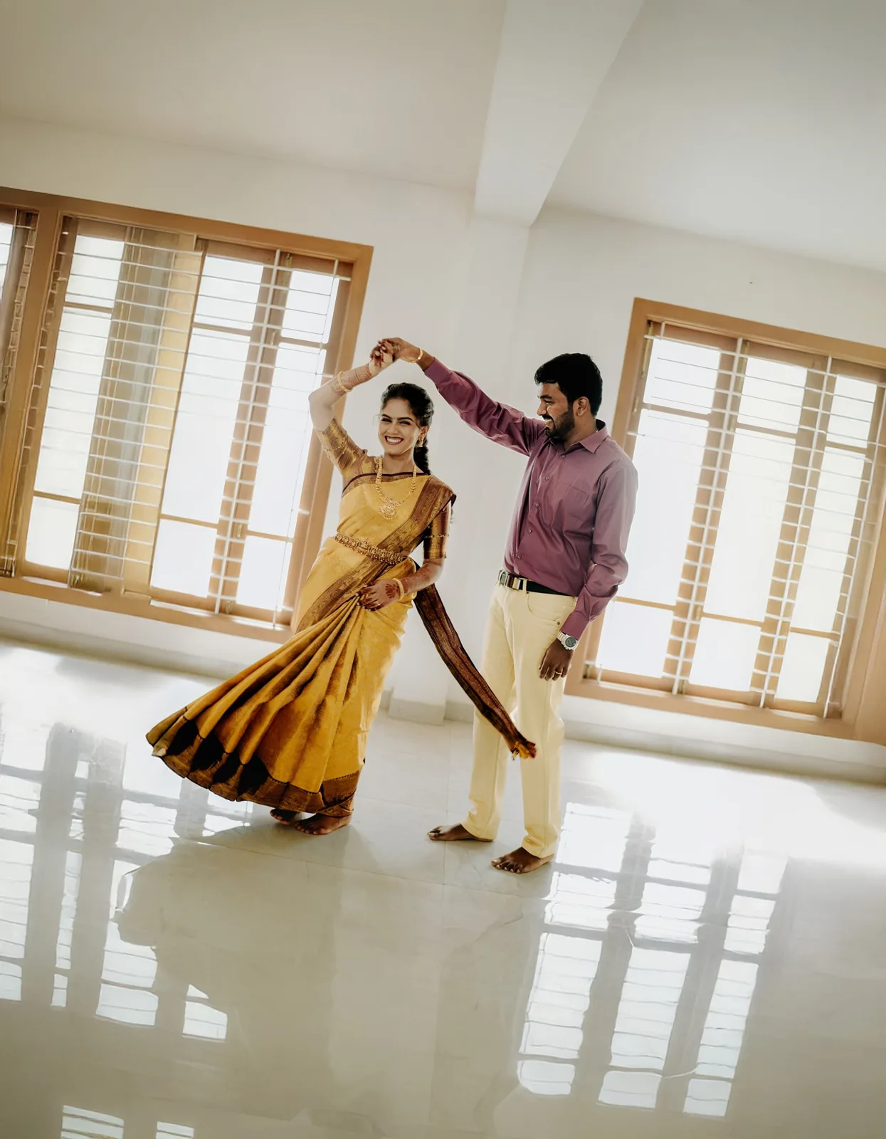 He twirls her across a sunlit room